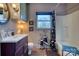 Well-lit bathroom featuring a sink, toilet, window, and shower at 842 Mary Knoll Ct, Rock Hill, SC 29730