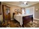Comfortable bedroom features a cozy bed, wooden cabinet, and a ceiling fan at 842 Mary Knoll Ct, Rock Hill, SC 29730