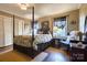 Spacious bedroom featuring a canopy bed, hardwood floors, and charming decor at 842 Mary Knoll Ct, Rock Hill, SC 29730