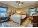 Bright bedroom with a bed, bedside tables, and natural light from windows at 842 Mary Knoll Ct, Rock Hill, SC 29730
