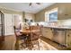 Classic eat-in kitchen with tan cabinets, stainless-steel appliances, and a cozy breakfast nook at 842 Mary Knoll Ct, Rock Hill, SC 29730