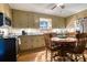 Kitchen with tan cabinets, neutral countertops, hardwood flooring and a four seat round table at 842 Mary Knoll Ct, Rock Hill, SC 29730