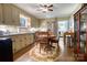 Traditional eat-in kitchen featuring tan cabinets, granite countertops and an adjacent stainless-steel refrigerator at 842 Mary Knoll Ct, Rock Hill, SC 29730