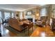 Comfortable living room with hardwood floors, a fireplace, and neutral décor at 842 Mary Knoll Ct, Rock Hill, SC 29730