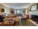 Comfortable living room flows into the dining area, showcasing fireplace and neutral tones at 842 Mary Knoll Ct, Rock Hill, SC 29730