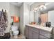 Bathroom featuring single sink vanity with framed mirror and neutral paint at 9068 Cinnabay Dr, Charlotte, NC 28216