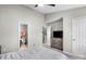 Bedroom featuring a ceiling fan and ensuite bathroom at 9068 Cinnabay Dr, Charlotte, NC 28216