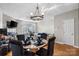 Cozy dining area featuring hardwood floors, modern lighting, and comfortable seating at 9068 Cinnabay Dr, Charlotte, NC 28216