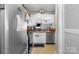 Galley kitchen features stainless steel appliances, neutral cabinets, and eat in space at 9068 Cinnabay Dr, Charlotte, NC 28216