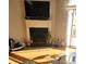Cozy living room featuring a fireplace with mantle and wood floors at 9068 Cinnabay Dr, Charlotte, NC 28216