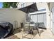 Charming outdoor patio with dining set, egg chair, and grill, perfect for entertaining guests at 9068 Cinnabay Dr, Charlotte, NC 28216