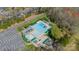 Aerial view of the community pool including lap lanes and a recreational pool area with seating and mature trees at 913 Dacavin Dr, Charlotte, NC 28226