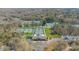 Aerial view of the community's tennis courts and clubhouse surrounded by lush landscaping and mature trees at 913 Dacavin Dr, Charlotte, NC 28226