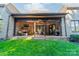 Expansive backyard featuring a covered patio perfect for entertaining or relaxing, with lush landscaping at 913 Dacavin Dr, Charlotte, NC 28226