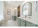 Elegant bathroom with double vanities, large mirrors, and a walk-in shower at 913 Dacavin Dr, Charlotte, NC 28226