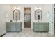 Modern bathroom with dual vanities, sleek mirrors, and a luxurious walk-in shower at 913 Dacavin Dr, Charlotte, NC 28226