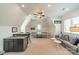 Expansive bonus room with high ceilings, a wet bar, and comfortable seating area for entertainment at 913 Dacavin Dr, Charlotte, NC 28226