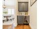 A chic butler's pantry with a wine fridge, gray cabinetry, and a stylish backsplash at 913 Dacavin Dr, Charlotte, NC 28226