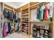 Walk-in closet with custom shelving and ample storage for clothes and shoes at 913 Dacavin Dr, Charlotte, NC 28226