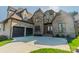 A well-maintained home with a combination of brick and stone exterior and spacious three car garage at 913 Dacavin Dr, Charlotte, NC 28226