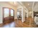 Elegant foyer with hardwood floors, decorative columns, and a view into the dining area at 913 Dacavin Dr, Charlotte, NC 28226