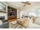 Open concept living room with a fireplace, built-in shelving, and a seamless flow to the dining area at 913 Dacavin Dr, Charlotte, NC 28226