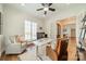 Sunlit home office with comfortable seating, a white desk, and neutral decor at 913 Dacavin Dr, Charlotte, NC 28226