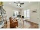 Bright home office with a leather chair, white desk, and two large windows at 913 Dacavin Dr, Charlotte, NC 28226