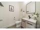 Contemporary powder room boasts a stylish vanity, modern fixtures, and elegant decor at 913 Dacavin Dr, Charlotte, NC 28226