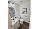 Stylish bathroom with modern fixtures, a sleek vanity, and a well-lit mirror, offering a comfortable and functional space at 915 2Nd St, Kings Mountain, NC 28086