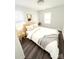 Bright bedroom with ample natural light, showcasing a comfortable bed and minimalist decor for a restful retreat at 915 2Nd St, Kings Mountain, NC 28086