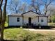 Charming one-story home with a covered front porch and a well-maintained lawn, perfect for enjoying the outdoors at 915 2Nd St, Kings Mountain, NC 28086