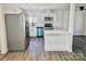 Well-lit kitchen featuring stainless steel appliances, a breakfast bar, and ample counter space, perfect for cooking and entertaining at 915 2Nd St, Kings Mountain, NC 28086