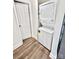 Efficient laundry area with a stacked washer and dryer, making laundry tasks convenient and streamlined at 915 2Nd St, Kings Mountain, NC 28086