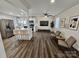 Open-concept living area with wood floors, sleek kitchen, and modern finishes, creating a perfect space for entertaining and relaxation at 915 2Nd St, Kings Mountain, NC 28086