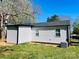 Rear exterior showcasing the new siding and roof; the AC unit is also visible at 915 2Nd St, Kings Mountain, NC 28086
