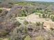 Aerial view of a golf course community surrounded by a beautiful wooded area at 1008 High Wedge Rd, Shelby, NC 28152