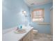 Bright bathroom with a single sink vanity, tile flooring, and window with wood blinds at 1008 High Wedge Rd, Shelby, NC 28152