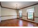 Spacious dining room with hardwood floors and a charming chandelier at 1008 High Wedge Rd, Shelby, NC 28152