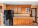 Functional kitchen with wood cabinetry, appliances, and ample counter space at 1008 High Wedge Rd, Shelby, NC 28152