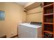 Functional laundry room with washer, dryer, overhead rack and built-in shelves at 1008 High Wedge Rd, Shelby, NC 28152