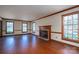 This expansive living room features hardwood floors, a fireplace, and plenty of natural light at 1008 High Wedge Rd, Shelby, NC 28152