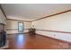 The living room showcases hardwood floors, a fireplace, and a baby grand piano at 1008 High Wedge Rd, Shelby, NC 28152