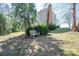 Inviting home exterior, with a lush green lawn and mature trees surrounding the property at 1008 High Wedge Rd, Shelby, NC 28152