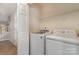 Laundry room with a front load washer and dryer and wire shelving for storage at 1026 Eagles Nest Ln, Fort Mill, SC 29707