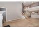 Spacious living area with staircase, offering an open layout and neutral decor at 1026 Eagles Nest Ln, Fort Mill, SC 29707