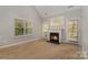 Comfortable living room featuring a fireplace, natural light, and easy deck access at 1026 Eagles Nest Ln, Fort Mill, SC 29707