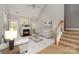 Bright living room featuring a cozy fireplace, vaulted ceiling, and elegant furnishings at 1026 Eagles Nest Ln, Fort Mill, SC 29707
