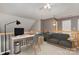 Upstairs living area with a comfortable sofa, a desk, and a ceiling fan at 1026 Eagles Nest Ln, Fort Mill, SC 29707
