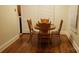 Dining area featuring hardwood floors, traditional chairs, and natural light at 1109 West Blvd, Charlotte, NC 28208